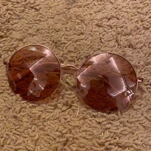 Rounded rose gold framed pink sunglasses